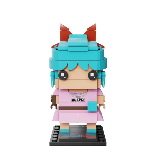 Toy figure made of interlocking bricks with blue hair and pink outfit on a white background